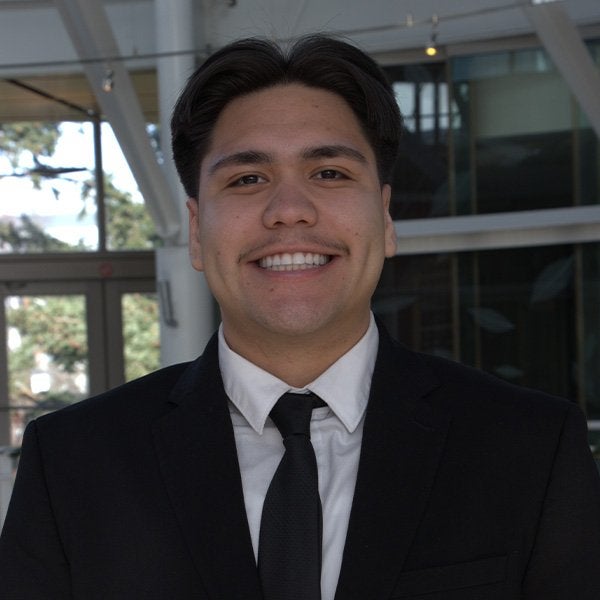 Student in a suit and tie