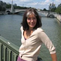 smiling woman on a bridge