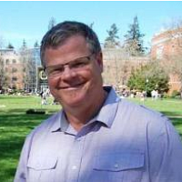 smiling man on campus