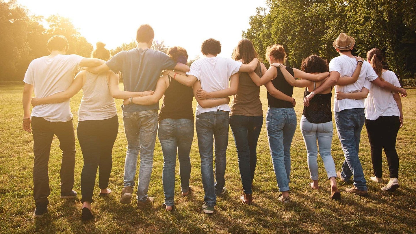 teens link arms in a row