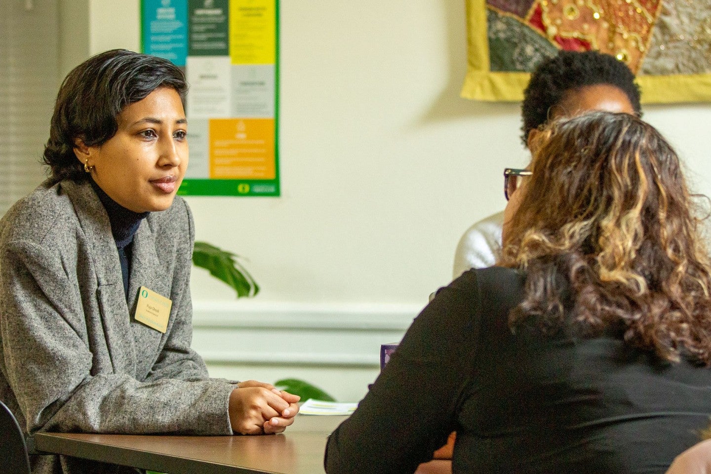 Graduate students gathering around a table