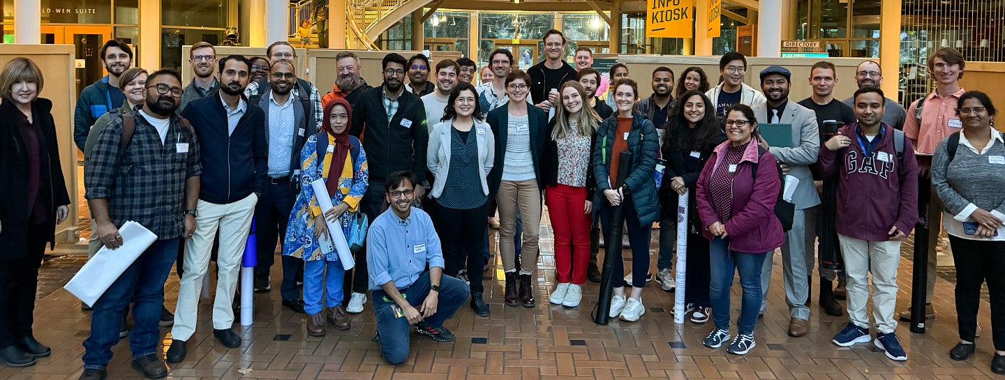 A large group of postdocs at a research symposium.