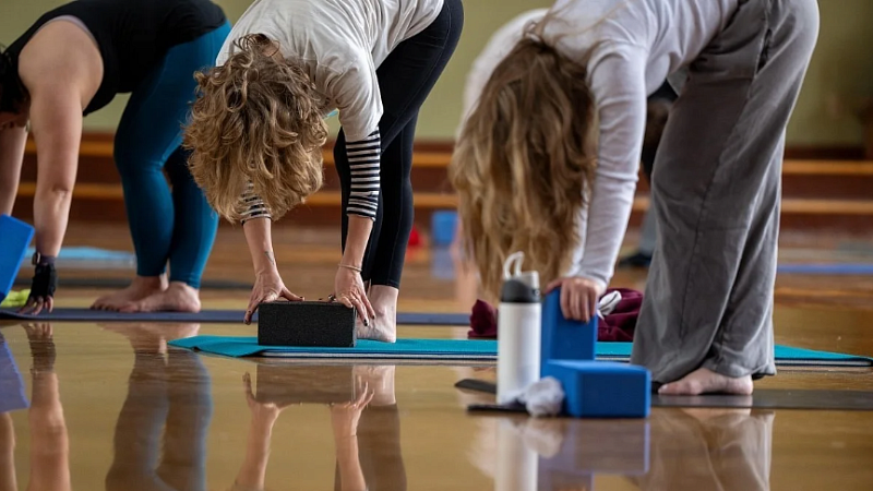 Women practicing yoga indoors