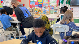 kids sitting at classroom desks