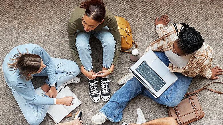 Students talking and studying together