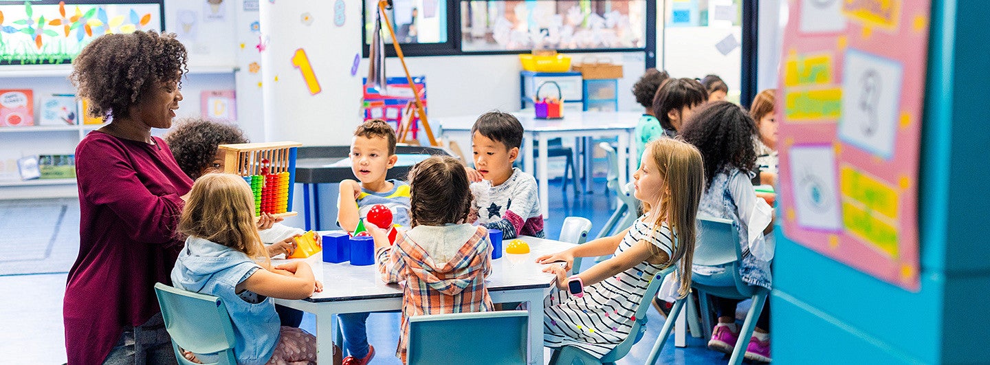 teacher working with a class of students