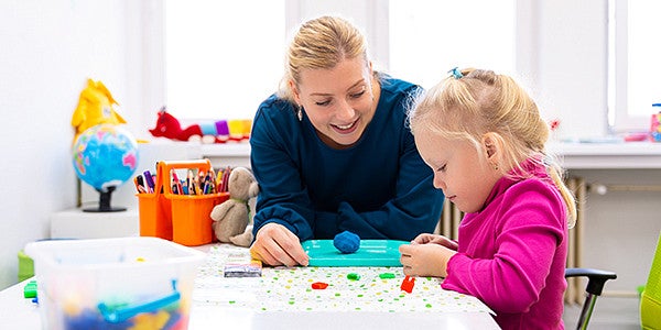 Child Care Health Consultants working with student