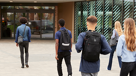 students walking into high school