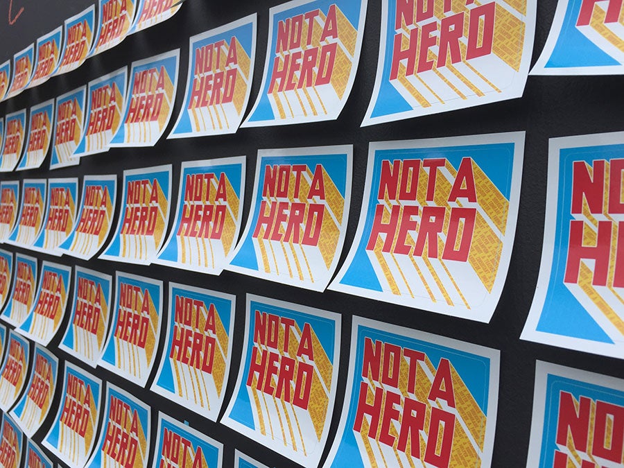 Long board filled with cards labeled Not a Hero.