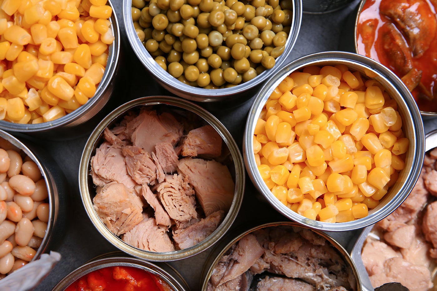 Assorted foods including corn, peas, beans, chicken, beef.