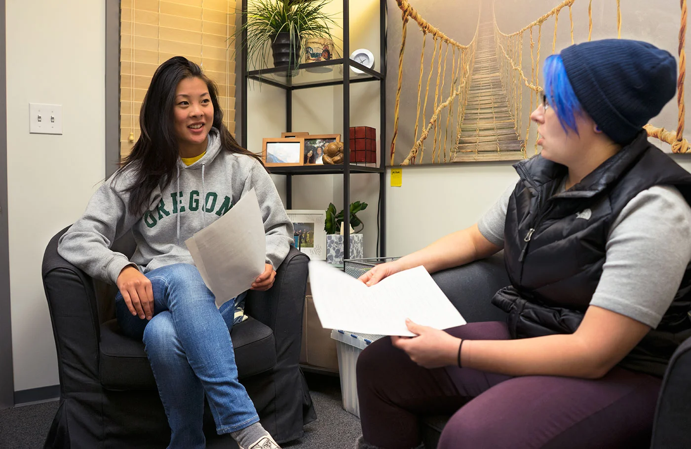 A student meeting with a student intern to review their strengths results in an office in the Holden Center.