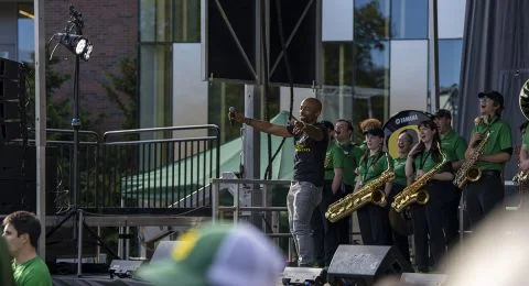 The emcee leads the crowd in a cheer