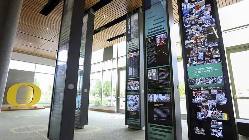 Alumni recognition wall displaying names and donor plaques inside the Ford Alumni Center.