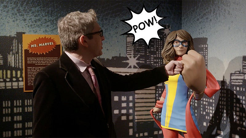 (Ben Saunders posing with a comic-themed sculpture.) Comics and Cartoon Studies Minor