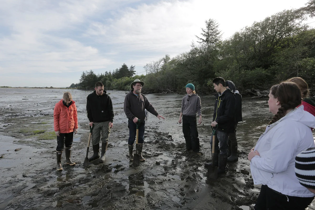 Oregon Institute of Marine Biology students on a beach during a field trip.
