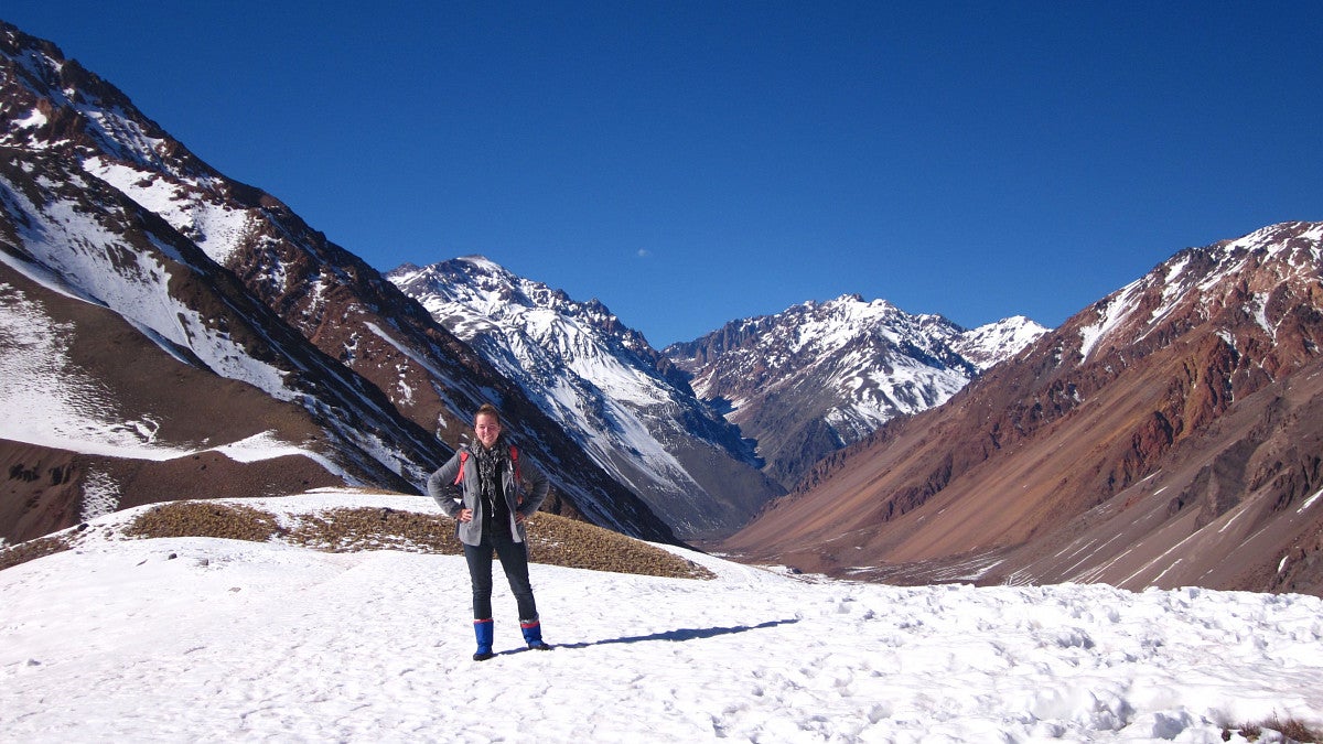 student on snow-covered slope with mountain range in background) GlobalWorks International Internships