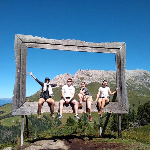 Students posing in front of mountain