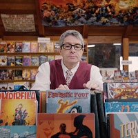 Pofessor Ben Saunders browsing comic books in a store. 