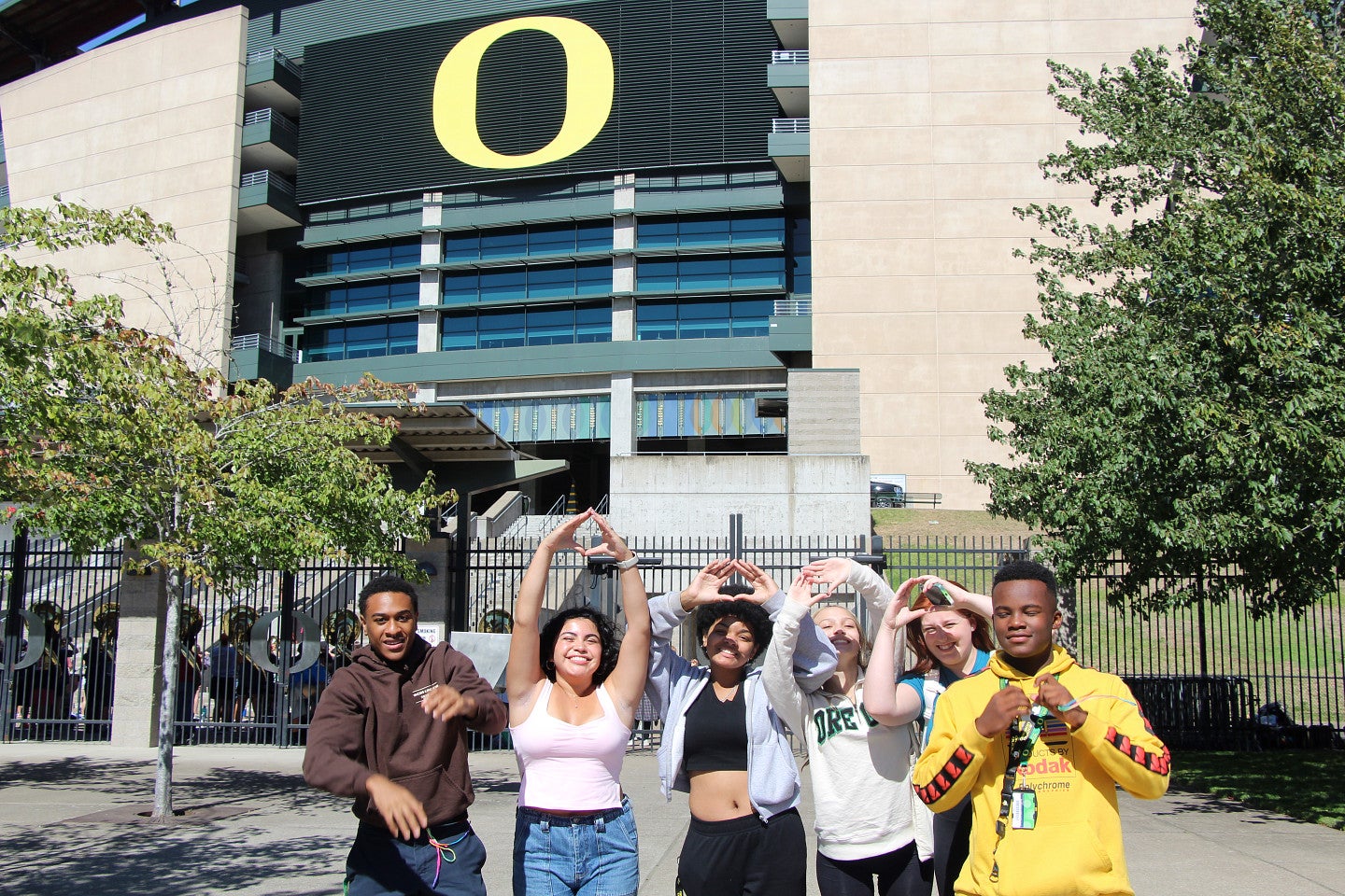 2023 NSFR Students put up an "O' in from of Autzen Stadium