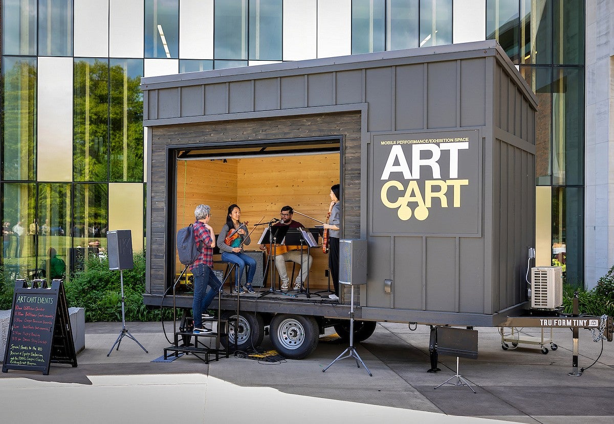 Art Cart, people playing music in it.