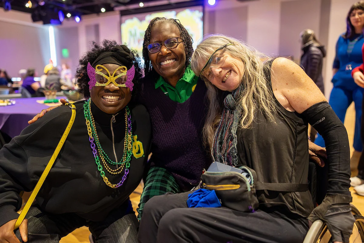 Three women smiling.