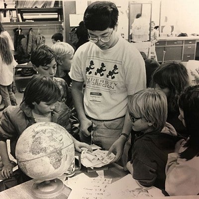 Chinese exchange student teaching children
