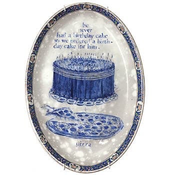 Porcelain dish with blue images of cake and pizza and text