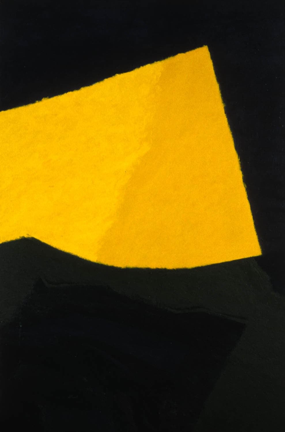 Abstract image of a yellow polyhedral shape on a black background