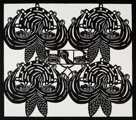 Intricate black and white papercut artwork featuring symmetrical patterns and figures, with a central scene depicting people and maize.