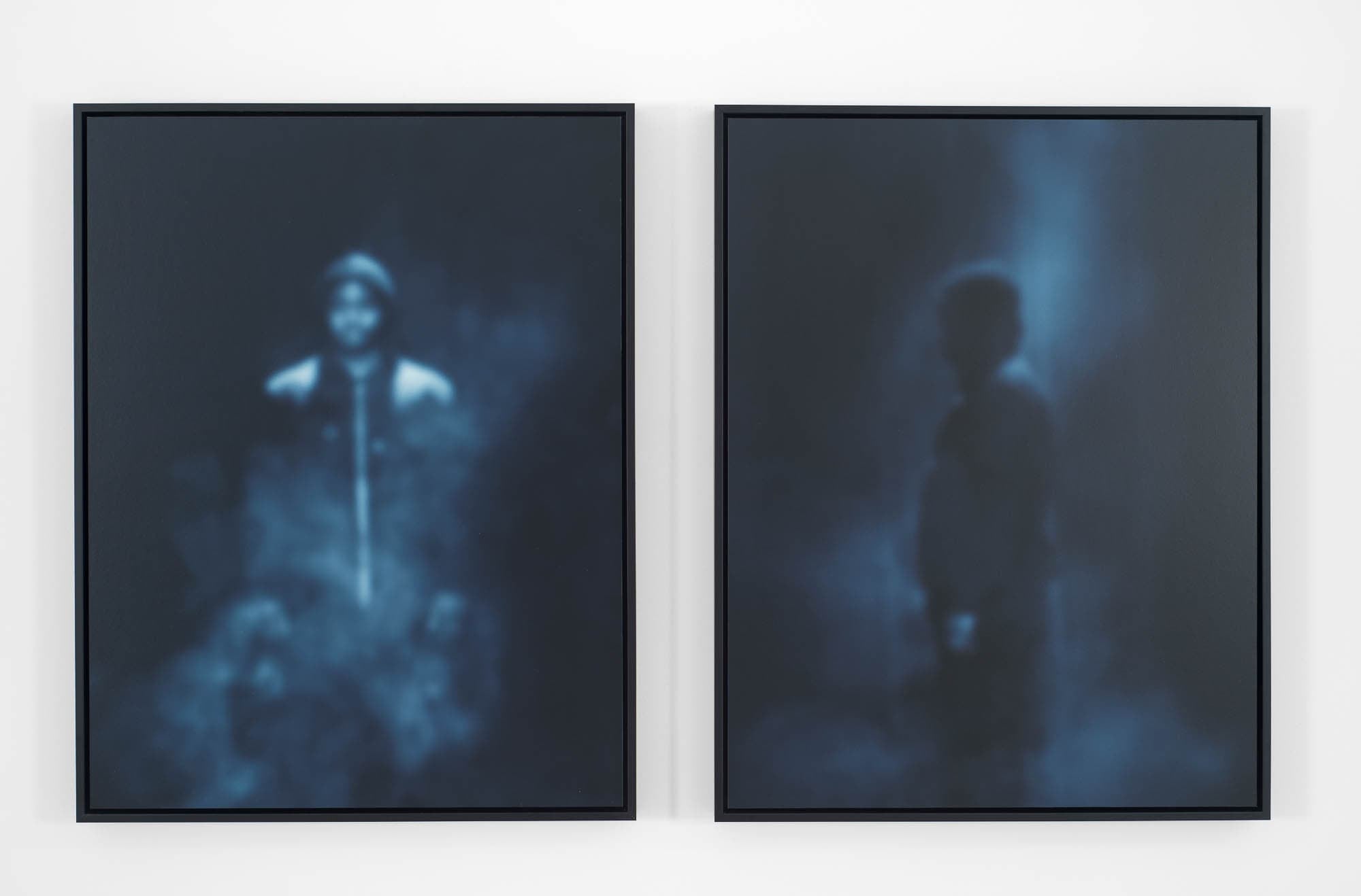 Two blurred images side by side, showing indistinct human figures.