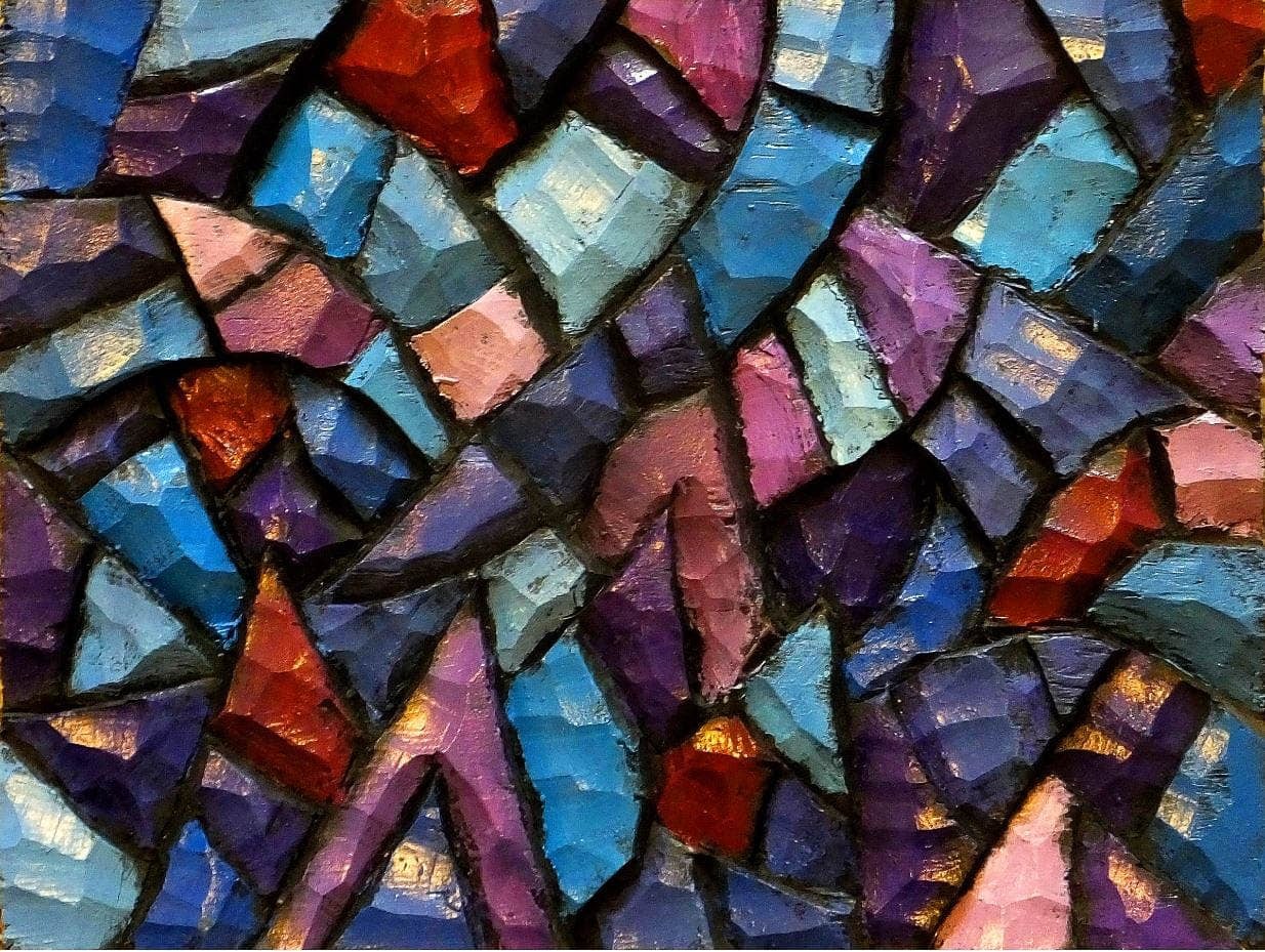 Close-up photograph of a mosaic artwork featuring colorful, jagged pieces.