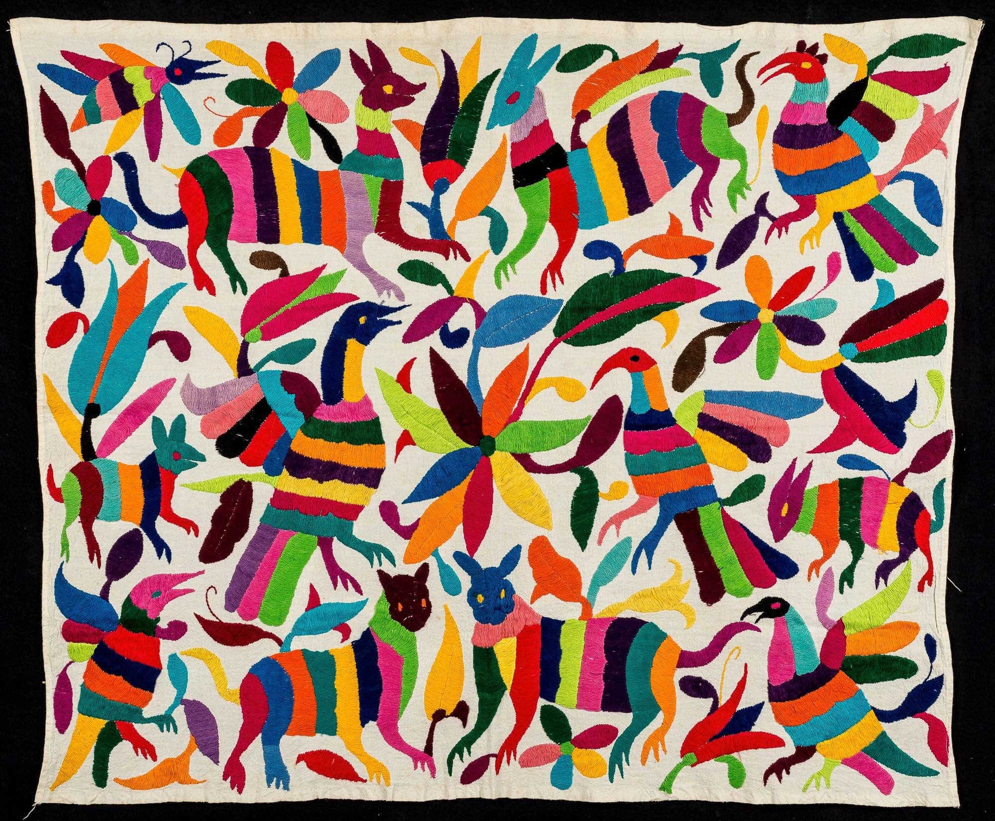 Brightly colored embroidered animals, birds, and flowers