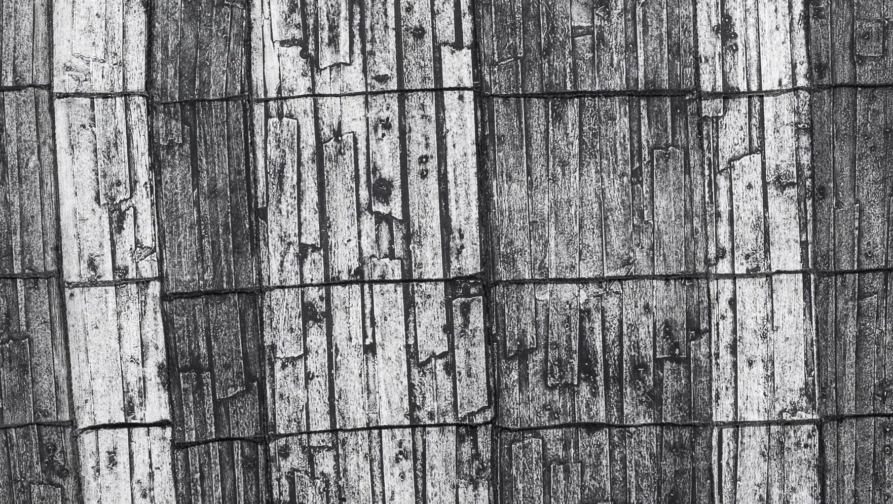 Black and white striped image with texture similar to a crayon rubbing of tree bark or a rough wooden surface