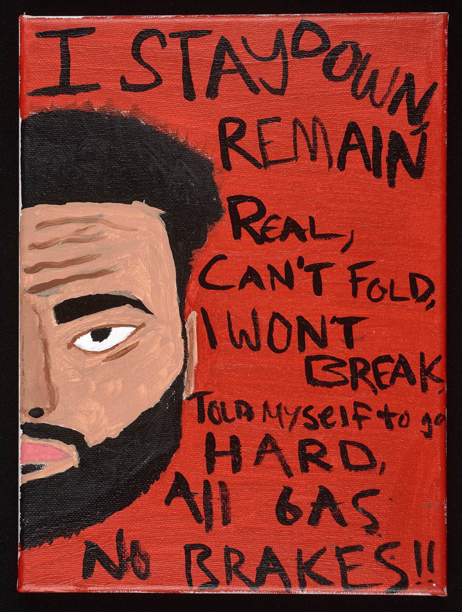 A painting featuring a man's face with a full beard on a red background, surrounded by handwritten motivational phrases such as "I STAY DOWN," "REMAIN REAL," "CAN'T FOLD," and "NO BRAKES!!"