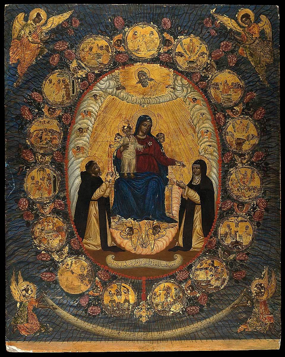 An ornate religious icon featuring the Virgin Mary with child, surrounded by an array of smaller religious scenes and angels, all richly adorned with gold accents and intricate detailing.