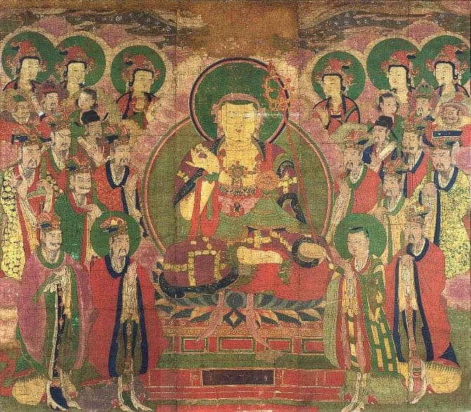 A traditional painting featuring a central Buddha figure surrounded by numerous attendants, all in rich colors with gold accents on a weathered background.