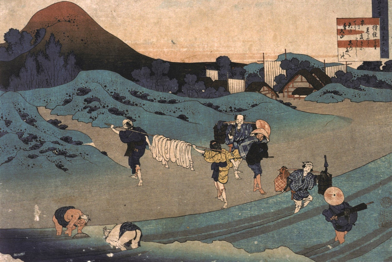 Japanese print of people bathing in a wavy sea