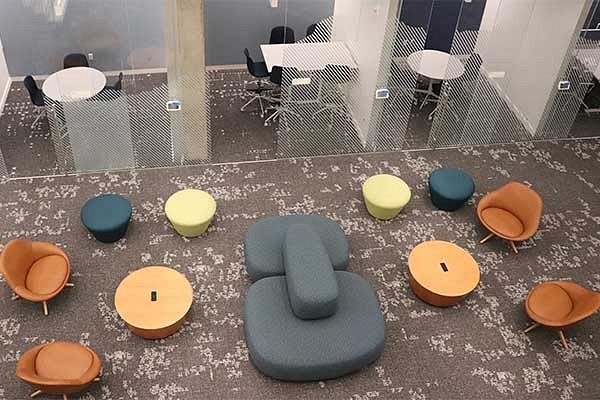 Overhead view of the fractal pattern on the carpert in the Knight Campus basement level