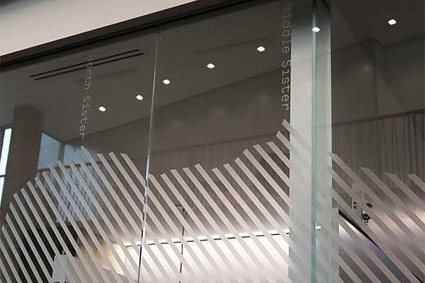 Etched glass representing the mountain peaks of Oregon showing North and Middle Sister