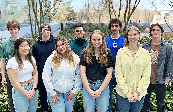A group of college students standing outside