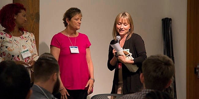 Program director Stacey York, presents Jeanne Beacham with the Excellence in Mentorship of Early Career Scientists Award.