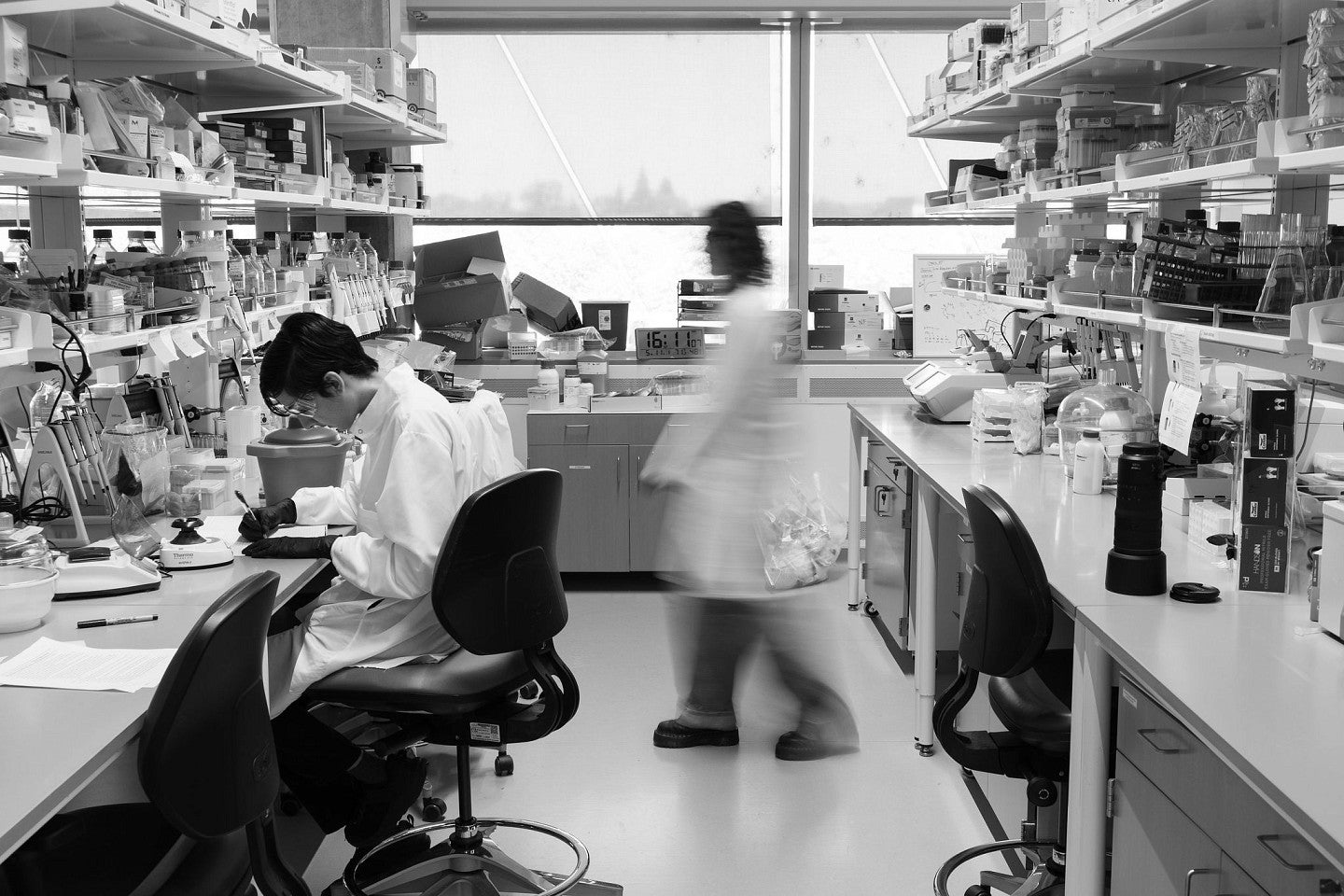 Student walking in lab