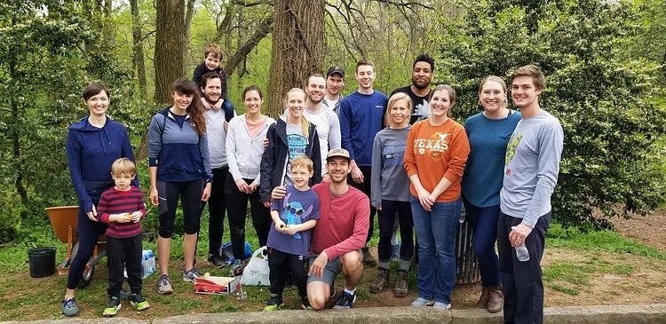 Group of people standing outside in a nature path