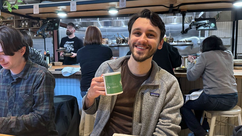 man holding a mug