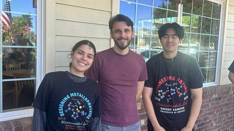 Group where a shirt with proteins, in front of a window 