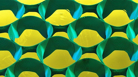 Cell Spheroid scientific image of micro-3d printed structure in yellow and green colors