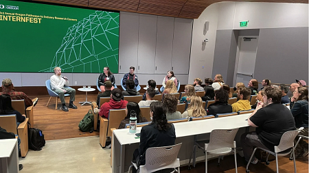 Panel speaking in a conference room at internfest