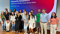 Students and mentors from the Wu Tsai Human Performance Alliance at Oregon stand in front of screen with title slide