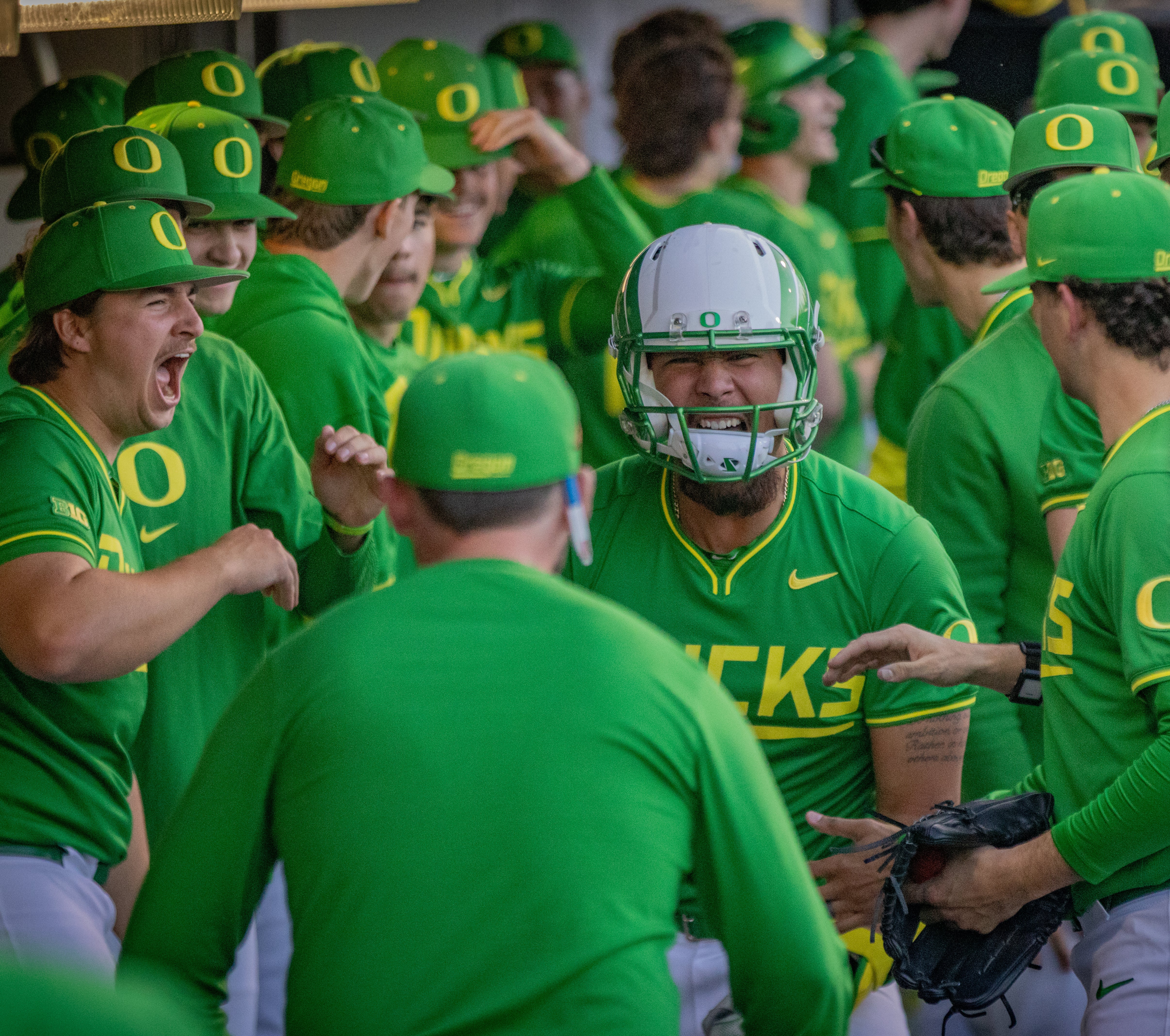 Oregon baseball celebrates by the dugout during a 15-2 victory on Apr. 5, 2025 against the Michigan Wolverines.