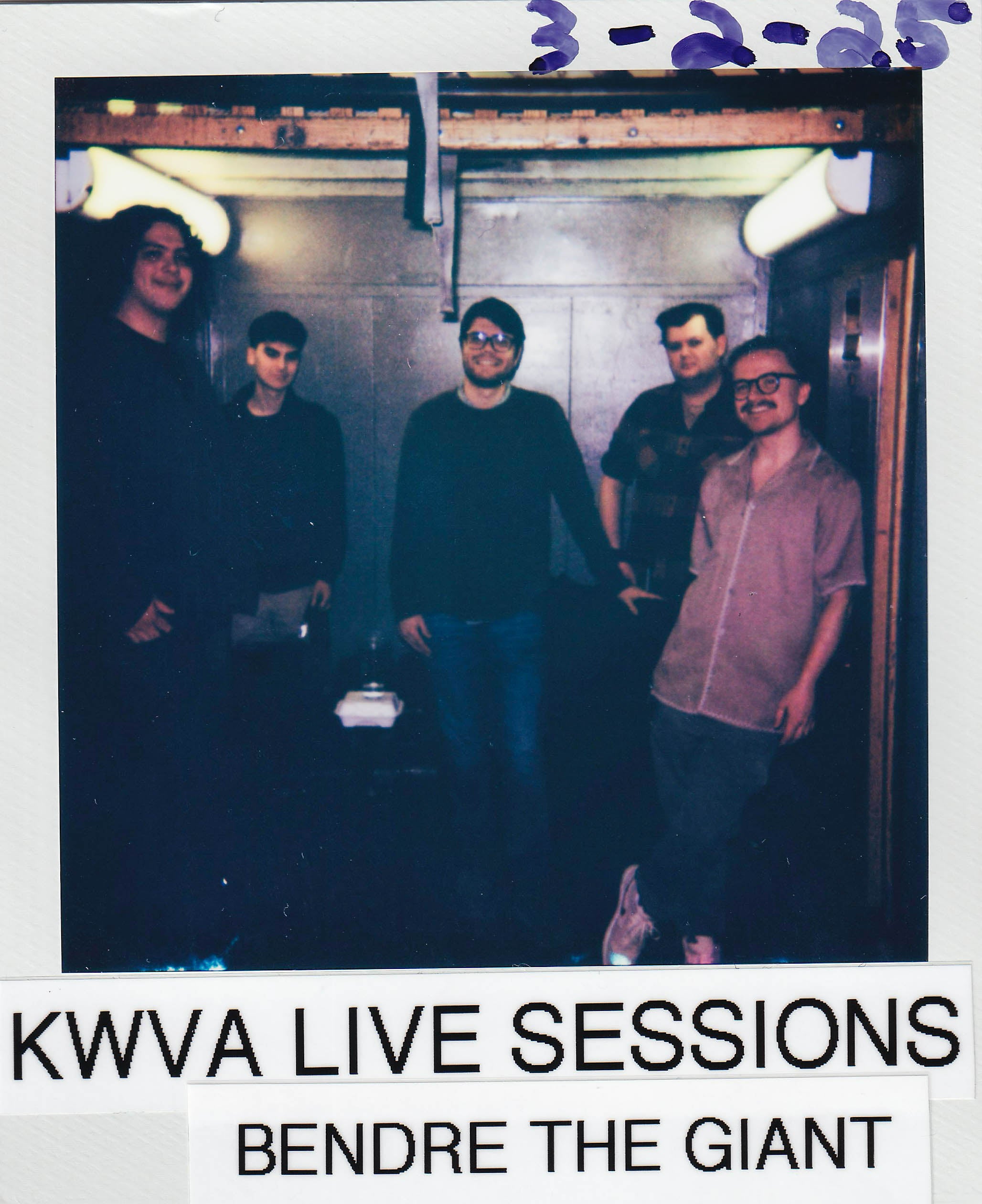 polaroid framed picture reading "3-2-25 KWVA LIVE SESSIONS BENDRE THE GIANT" featuring the members of the local band Bendre the giant posing in a freight elevator.